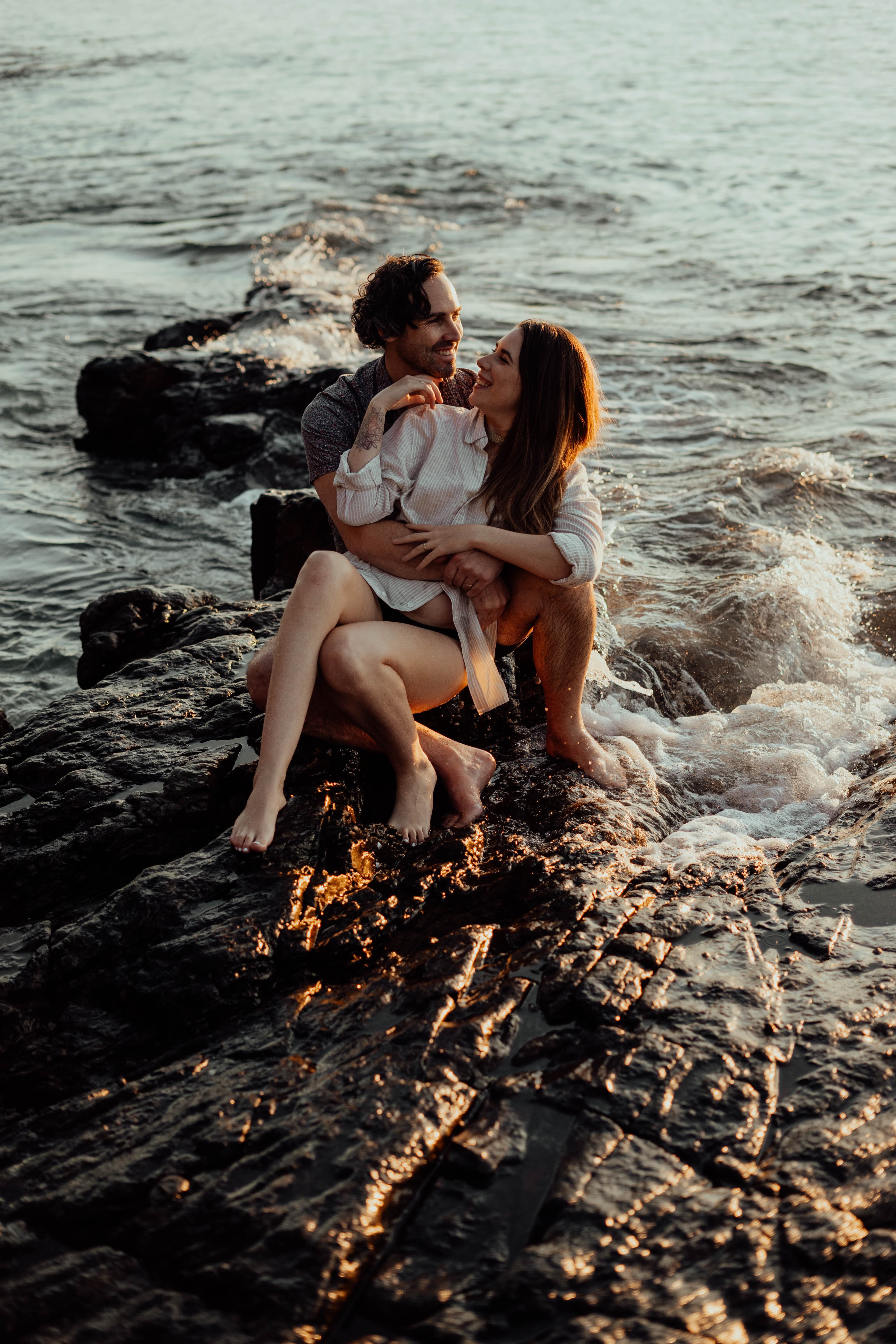 Couple sitting together by the ocean for the Dating for Love quiz